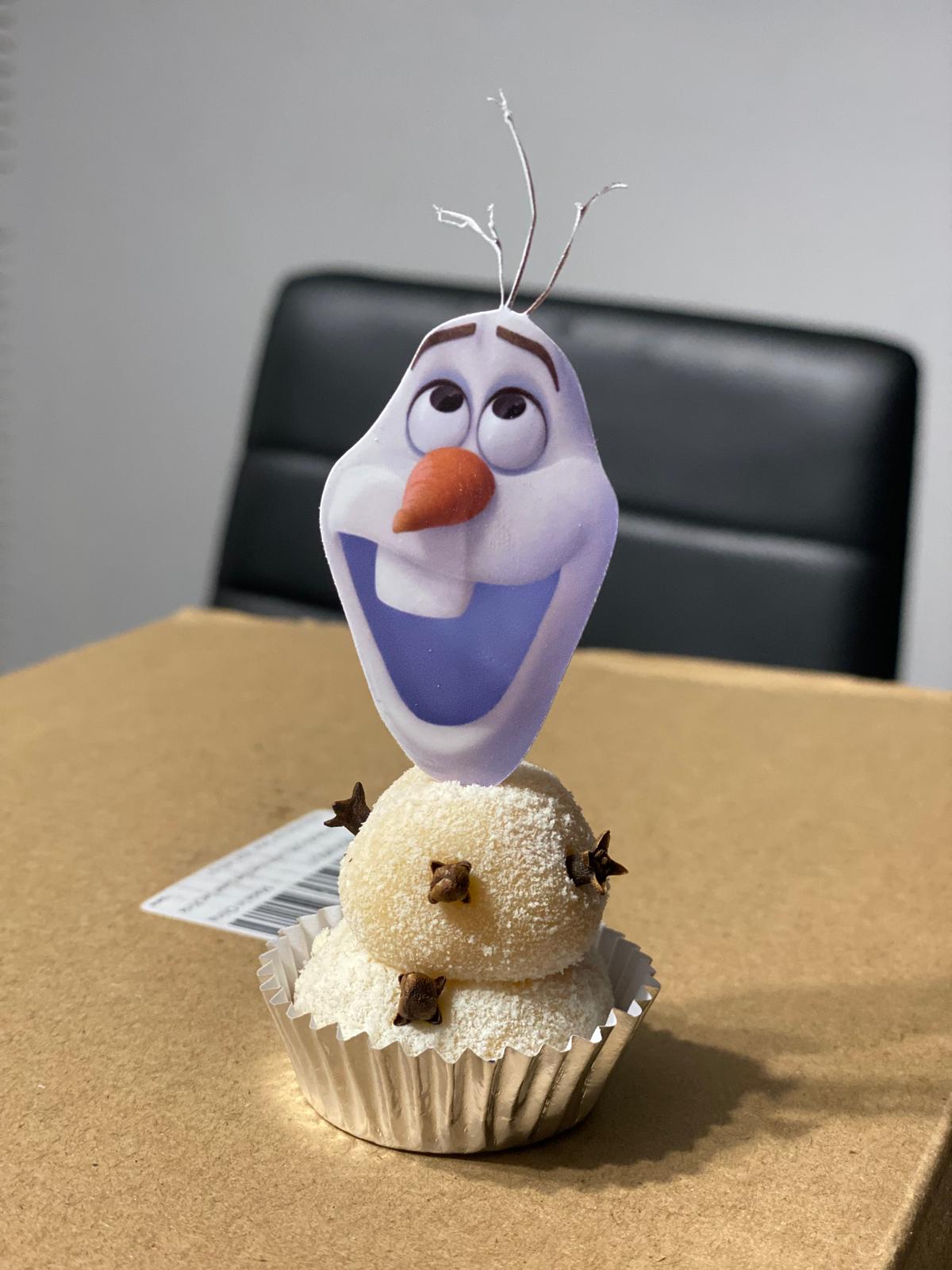 Custom Frozen Olaf edible-style topper on coconut brigadeiro for themed birthday dessert table
